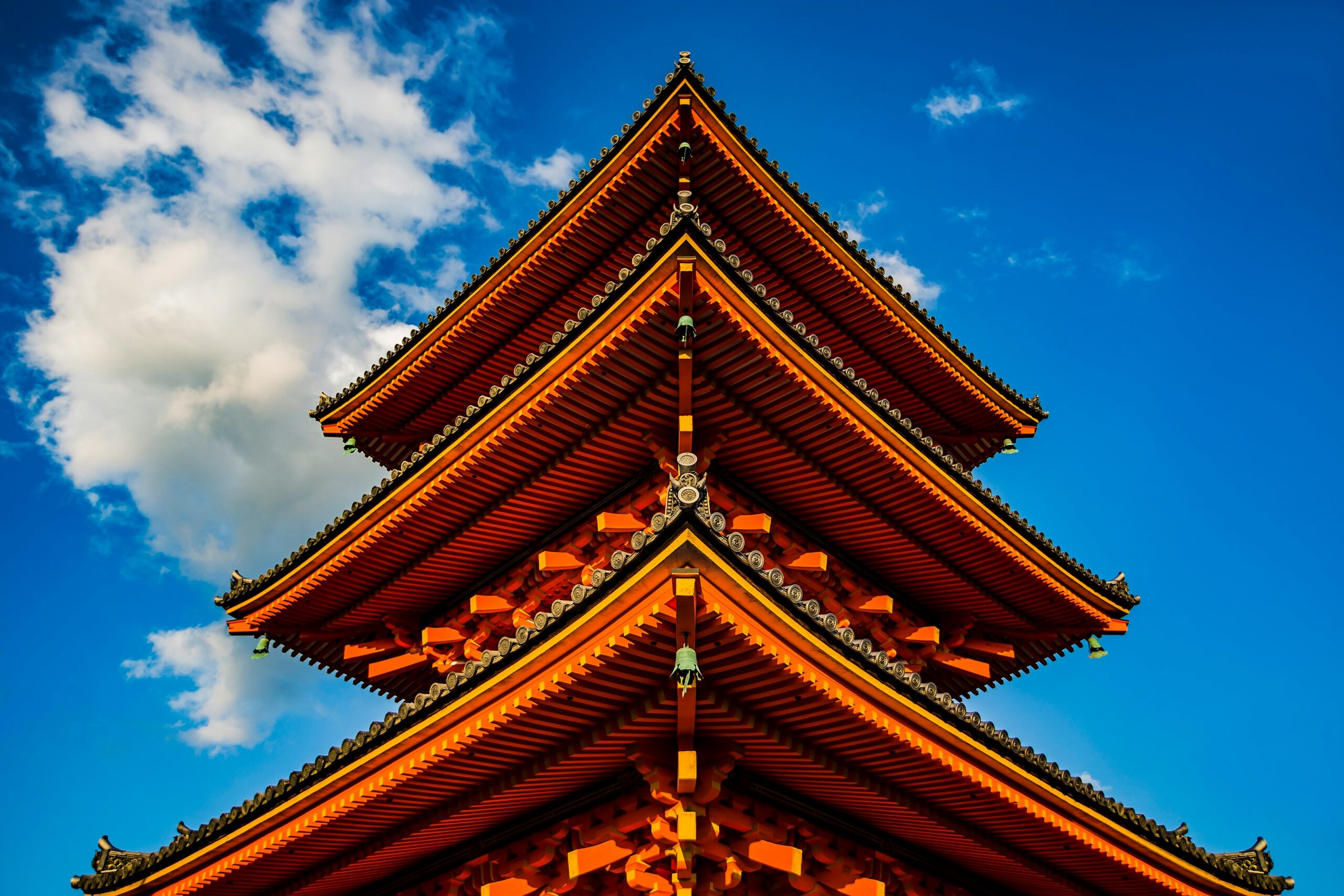 orange tower under white and blue sky